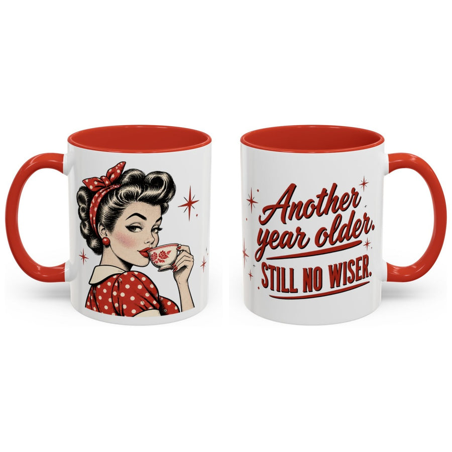 Another year older. Still no wiser. mug, 11oz white ceramic, red handle and interior, handle right