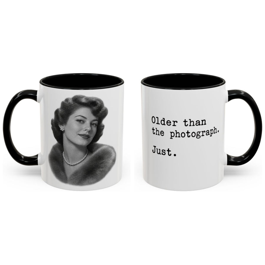 Older than the photograph. Just. mug, 11oz white ceramic, black handle and interior, handle right