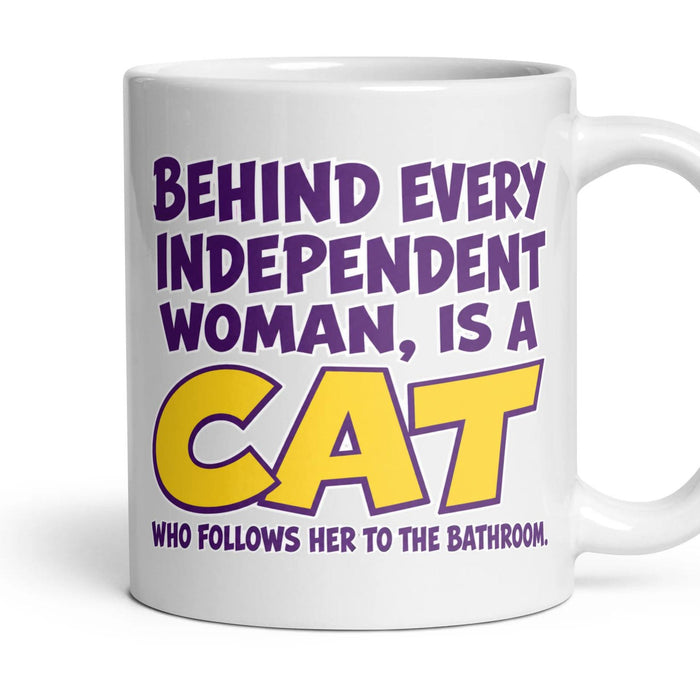 Behind every independent woman, is a CAT who follows her to the bathroom. mug, 11oz white ceramic, handle right
