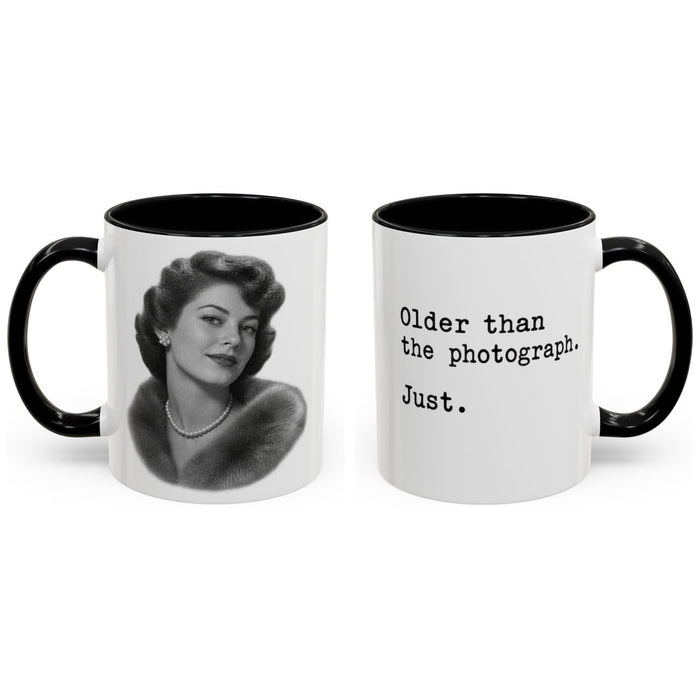 Older than the photograph. Just. mug, 11oz white ceramic, black handle and interior, handle right